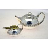 A George III heavy quality silver teapot of compressed melon form with cast shell and anthemion
