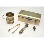 An Art Deco style silver cigarette box, Birmingham 1940, to/w a small Christening mug,