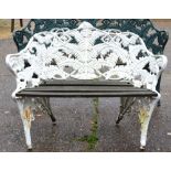 An old Coalbrookdale style cast iron garden bench of fern design with woodslat seat,