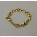 A 9ct yellow gold ornate linked bracelet, length approximately 20 cm,