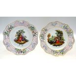 A pair of German porcelain cabinet plates with shaped reticulated borders,