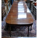 A large 19th century mahogany dining table,