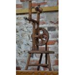 A child's spinning wheel with chamfered frame