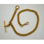 An 18ct gold curb-link single Albert watch chain with T-bar, ring-clip and dog-clip,