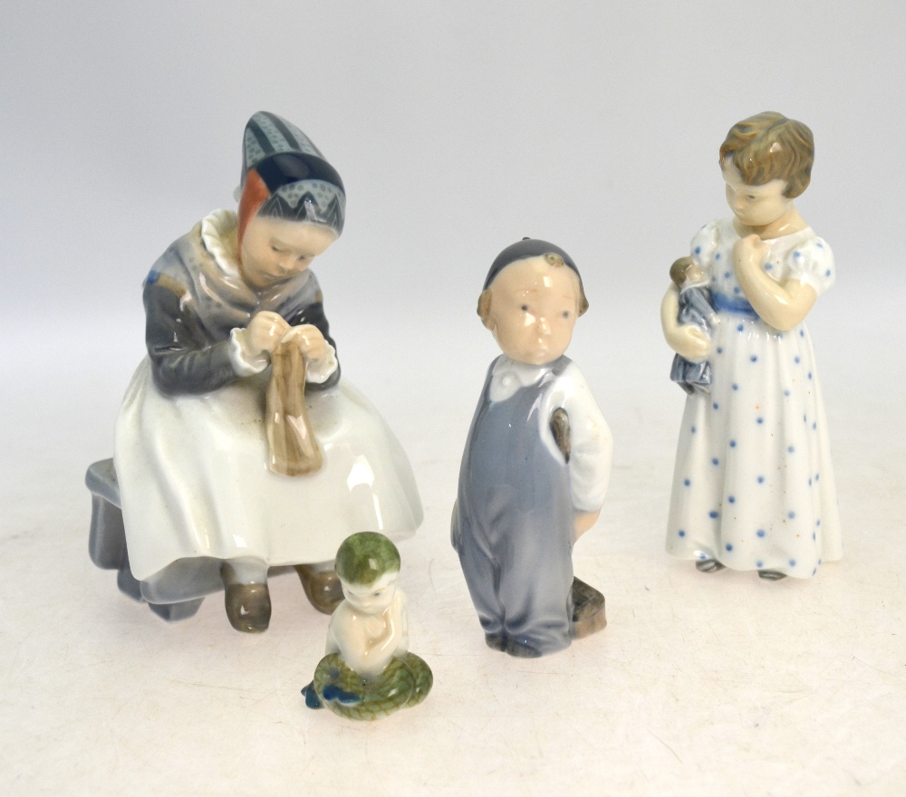 Four Royal Copenhagen models: Girl Knitting, no 1314; Boy with Broom,