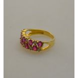 WITHDRAWN A ruby and diamond two row claw set eternity ring,