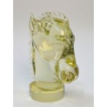 A translucent glass or crystal horse's head, on cylindrical base; signed, L.
