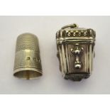 A Victorian thimble-case of square tapering form with embossed decoration,