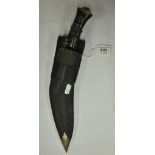 An inter-war Nepalese kukri knife, the brass and metal studded wooden grip with lion mask end,