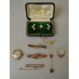 A quantity of yellow metal jewellery including three bar brooches, one ring, one pendant necklace,