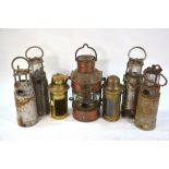 A copper masthead lantern (glass a/f) 30 cm to/w four bilge-lamps and two brass binnacle-lanterns