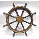 A Victorian brass-mounted ship's wheel with turned spokes,