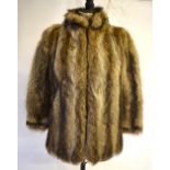 A tawny wolverine fur jacket with neru collar,