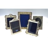 Two modern silver-faced photograph frames and three other electroplated examples (5)