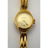 A lady's Rotary 9ct gold wristwatch with 15 jewel movement on expanding two-bar bracelet strap,