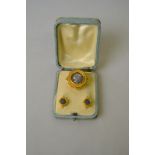 A Grand Tour suite of brooch pendant and earrings enclosing Roman coins in bloomed gold