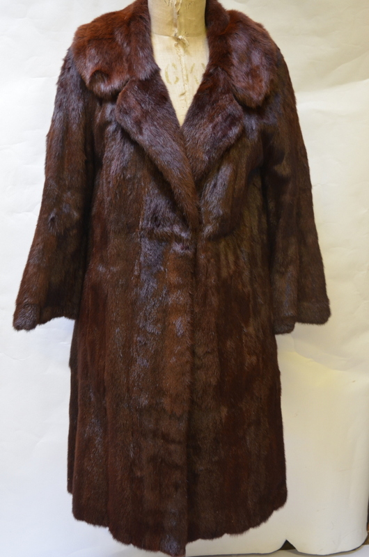 A vintage full-length brown fur coat retailed by Hickleys with brown satin lining,