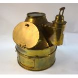 A large copper binnacle compass cover with spirit lamp,