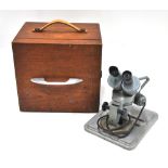 A 'Watson Barnet' binocular microscope with light separate mains transformer in box,