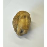 A small Medieval period carved alabaster/stone head, a fragment,