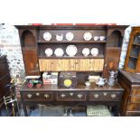 An 18th century style crossbanded oak high dresser,