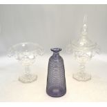 A pair of 19th century cut glass bonbonieres, one with cover, having fold over rims,