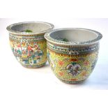 An associated pair of polychrome enamel fish bowls;