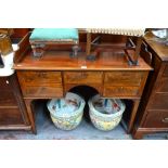 A 19th century crossbanded and inlaid mahogany gallery backed kneehole side table,