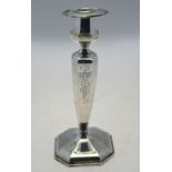 A US loaded Sterling single candlestick of octagonal baluster form with detachable grease-pan,