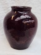 A Moorcroft flambe vase decorated in the pomegranate pattern, impressed marks,