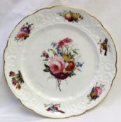 A Nantgarw porcelain plate decorated with birds and sprays of garden flowers to a moulded and gilt
