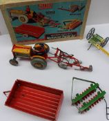 A Mettoy Playthings Modern farming Mechanical Tractor set boxed together with a Mamod steam engine