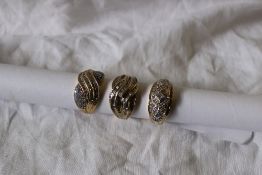 A 14ct yellow gold diamond set dress ring, together with two 9ct yellow gold dress rings,