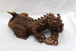 A Chinese hardwood carving of a dragon 36cm long
