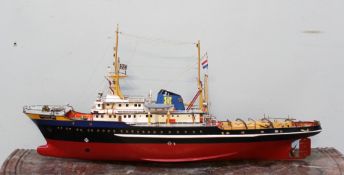 A model of the tug boat `Zwarte Zee`, of Rotterdam, of wooden construction,
