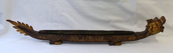 A large 19th century Chinese lacquered 'dragon boat' incense timekeeper,