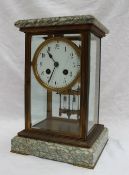 A French marble and brass four glass mantle clock, with a rectangular moulded top,