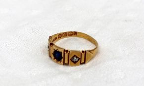 A sapphire and diamond ring set with a single sapphire and two old cut diamonds to an 18ct yellow