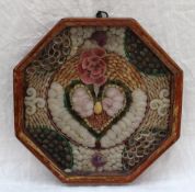A 19th century shell work valentine, worked in colours with numerous varied coloured shells,
