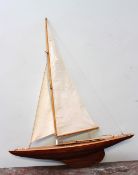 A scratch built pond yacht, with two sails and ropes, 77cm long x  98.