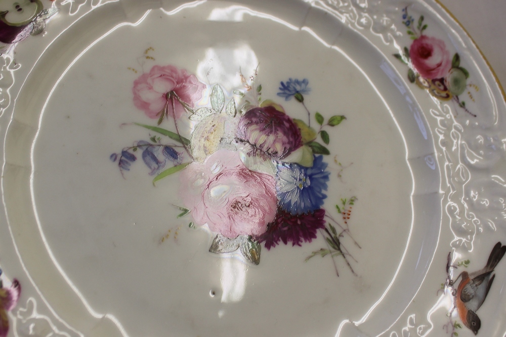A Nantgarw porcelain plate decorated with birds and sprays of garden flowers to a moulded and gilt - Image 2 of 5