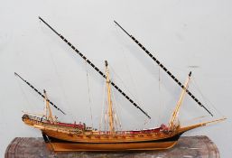 A scratch built model of a sailing boat,