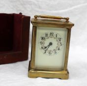 A 20th century French Brass carriage timepiece,