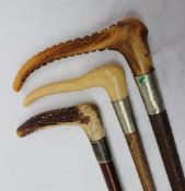 Three antler handled and leather hunting whips one marked Swaine