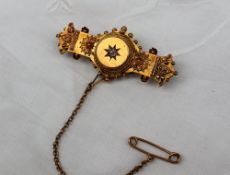 A 15ct yellow gold brooch, with a central diamond and wirework and ball decoration,