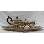 A George V silver three piece teaset, with a beaded rim,