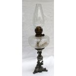 A Victorian electroplated oil lamp with a moulded clear glass reservoir,