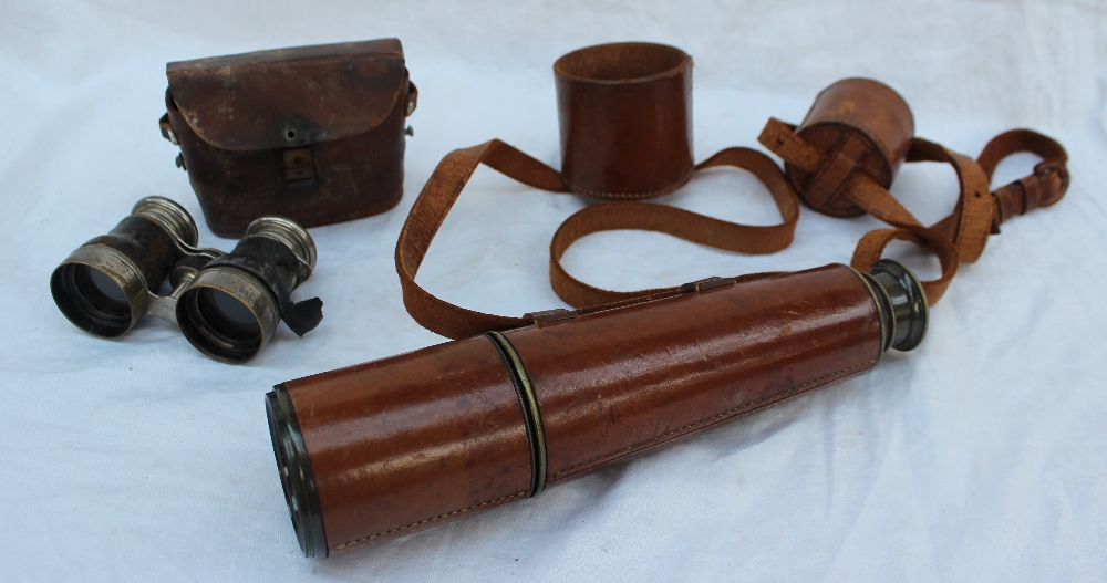 A John Barker & Co Ltd four drawer telescope with leather coverings and caps together with a pair