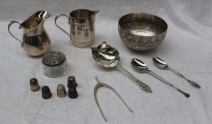 A George V silver cream jug, London, 1913, together with another cream jug, spoons, thimbles,