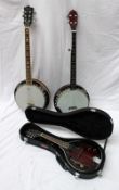 A six string banjo with mother of pearl star decoration and Remo Weatherking head, 98cm long,